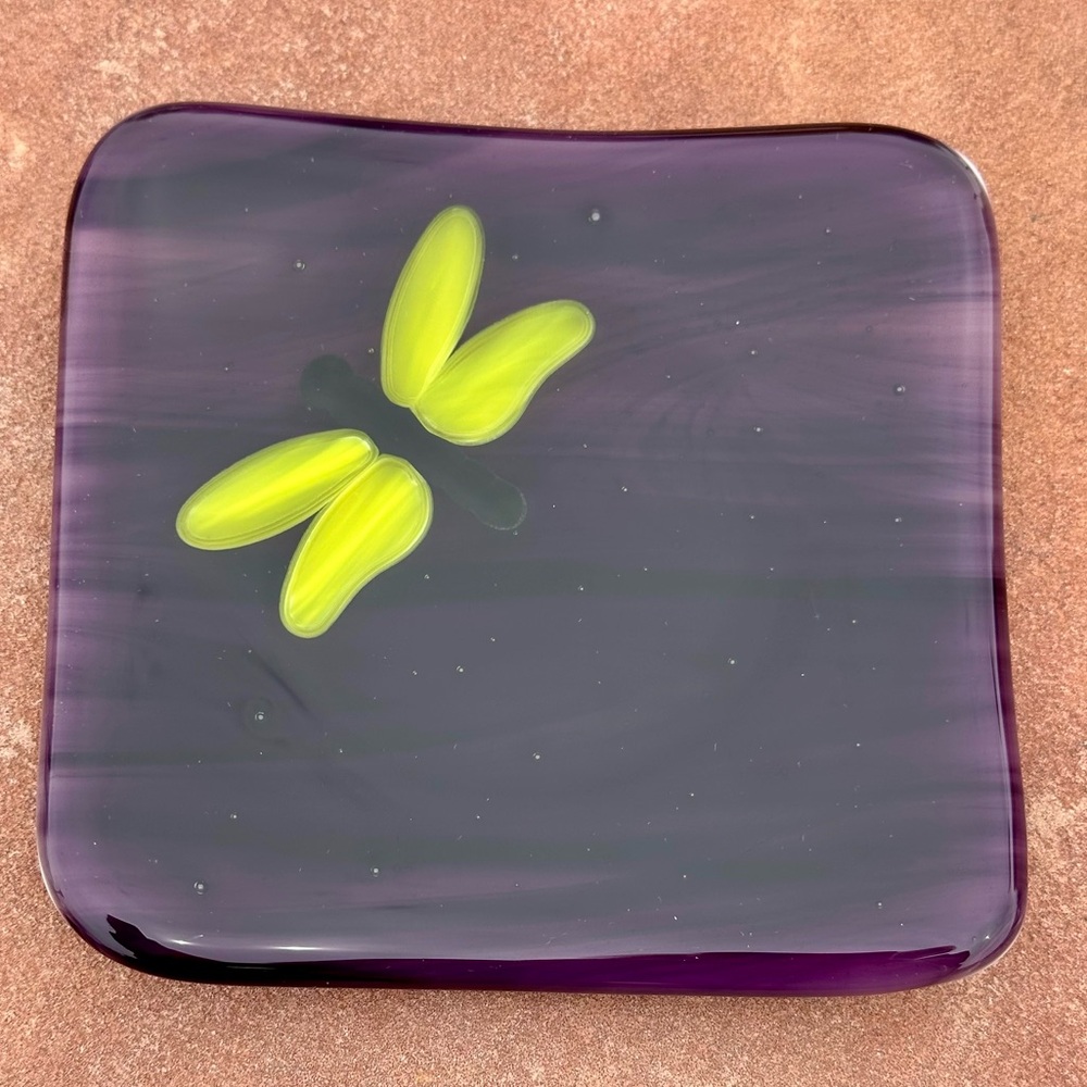 Dragonfly glass trinket dish. Purple and yellow with white back. Artist signed.